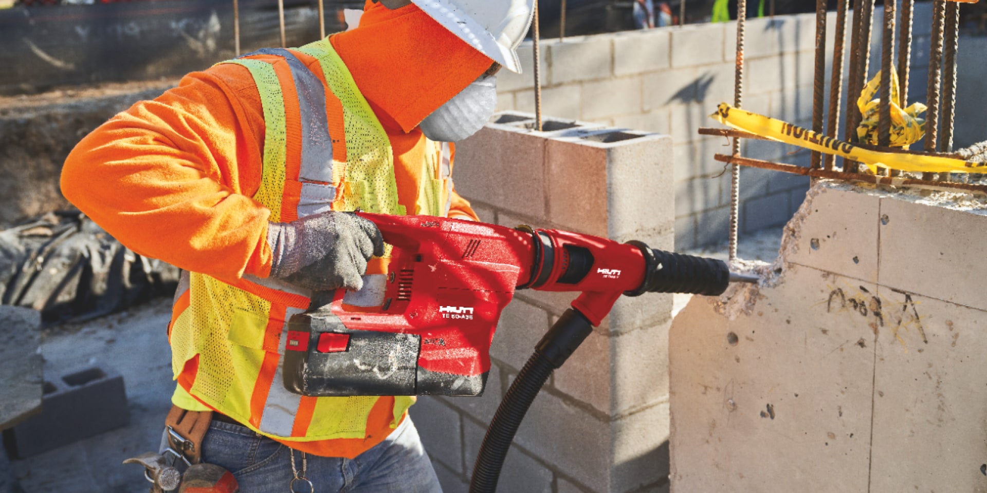 Construction worker using a TE 60-A36 Cordless combihammer  with Active Torque Control (ATC) to help prevent kickback